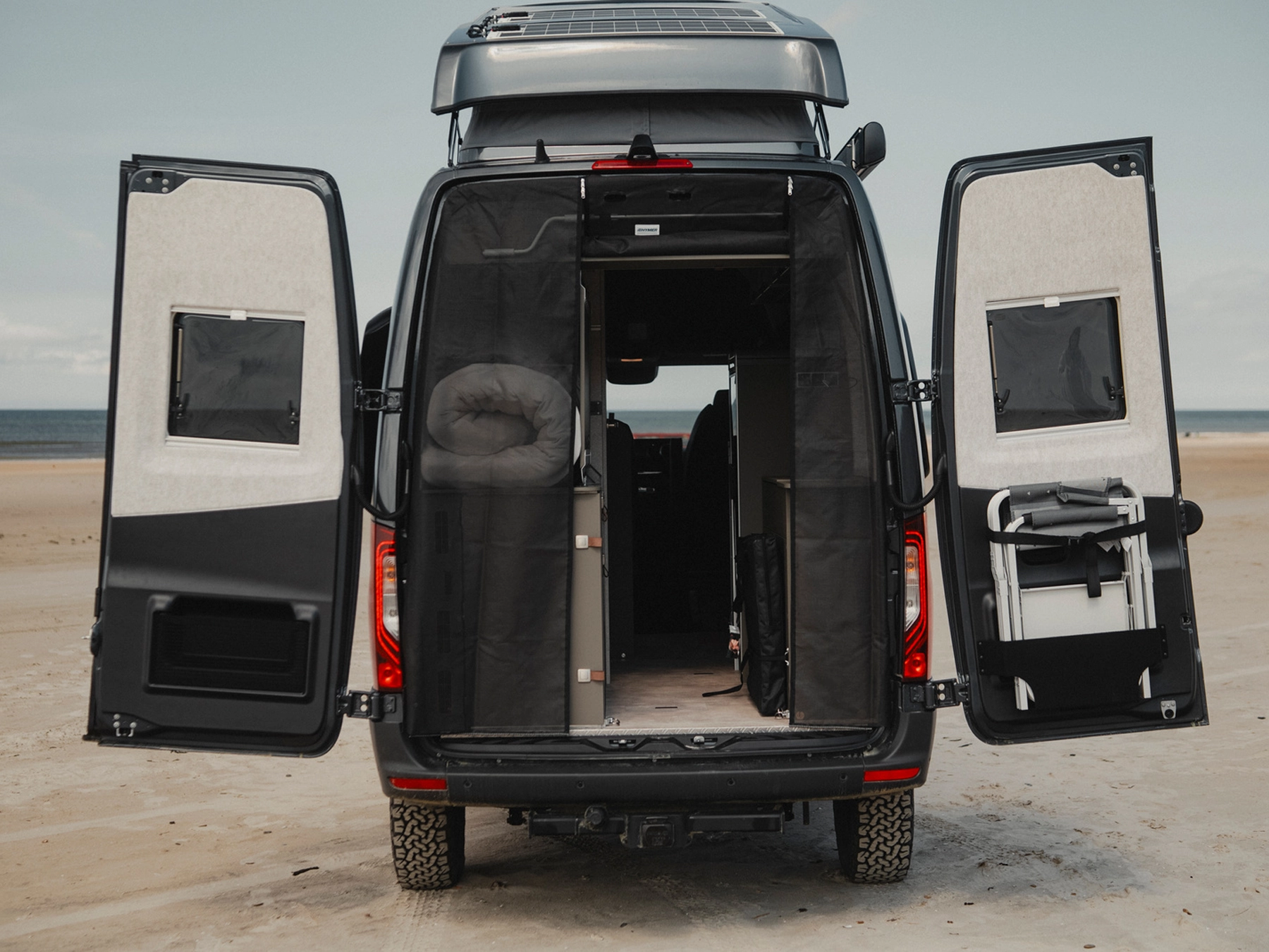 Hymer Grand Canyon S Crossover Campervan - Exterior Rear Open Flyscreen Half