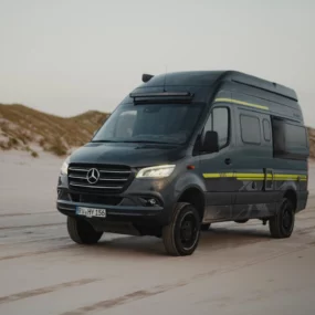 Hymer Grand Canyon S Crossover Campervan - Lifestyle Exterior Front Left Beach